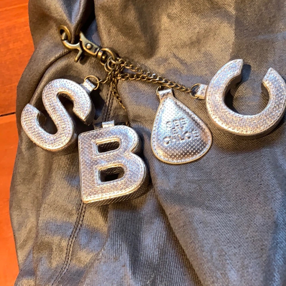 See by Chloe large bag with lots of pockets. Cute leather logo letter charms.